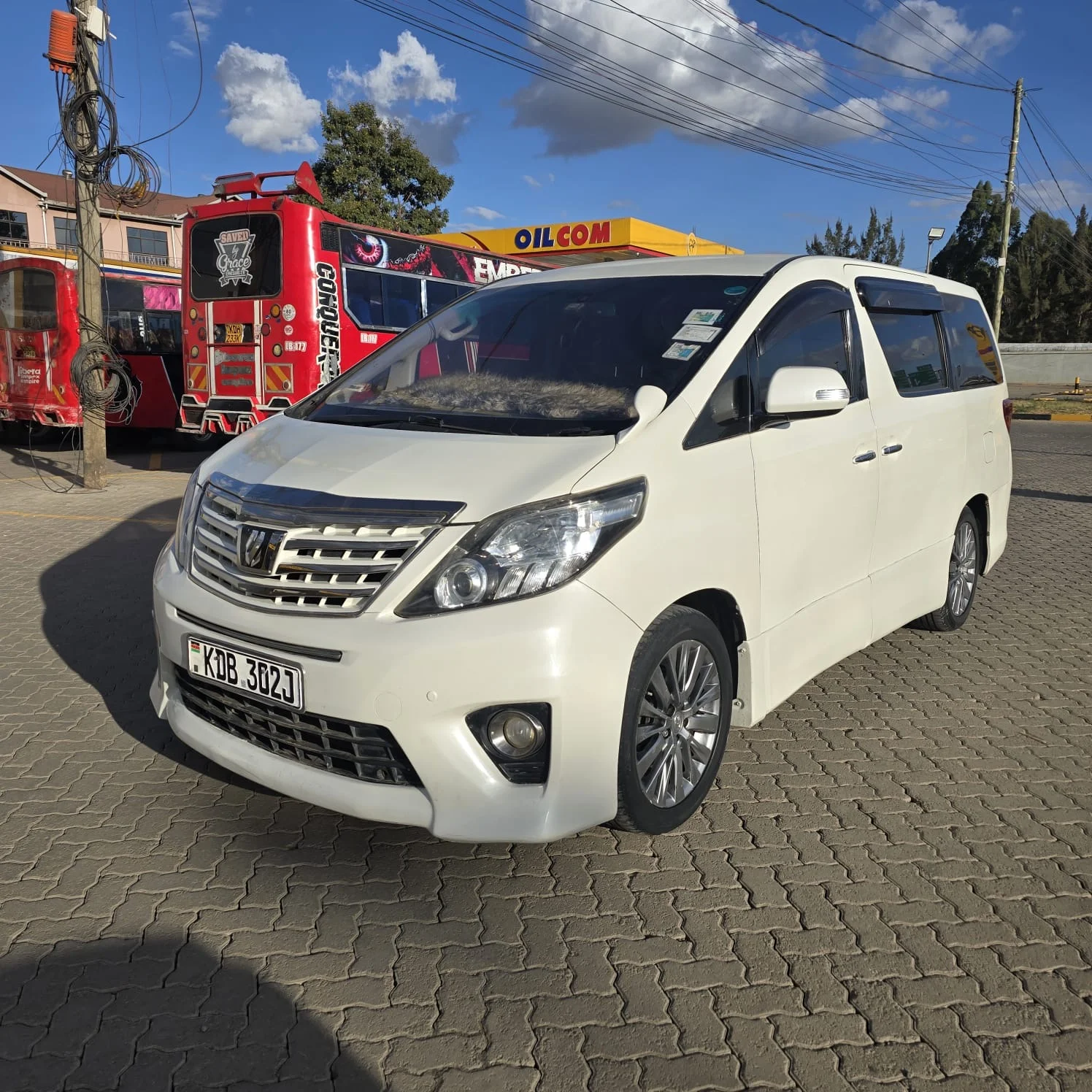 White Toyota Alphard KDB 362J — front three-quarter view