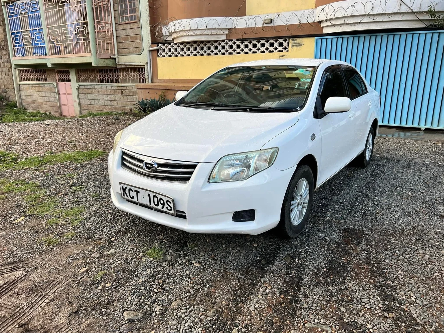 White Toyota Axio KCT 109S — front three-quarter view