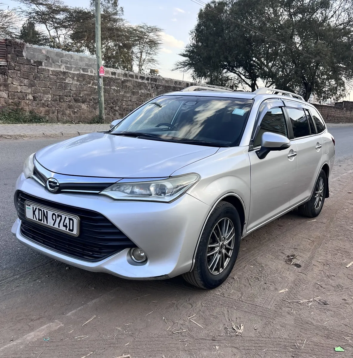 Silver Toyota Fielder KDN 974D: front three-quarter view
