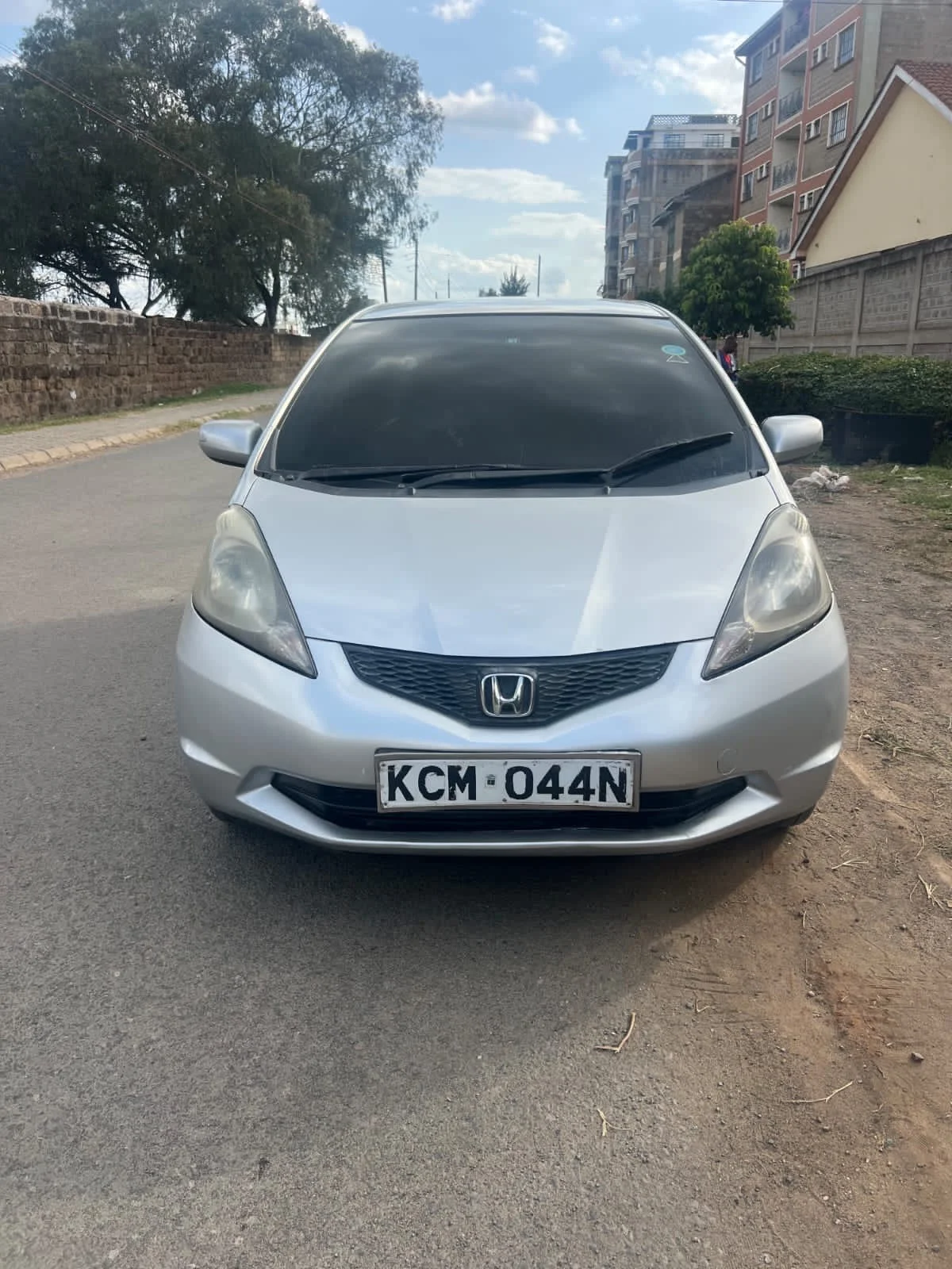 Silver Honda Fit KCM 044N — photo 1