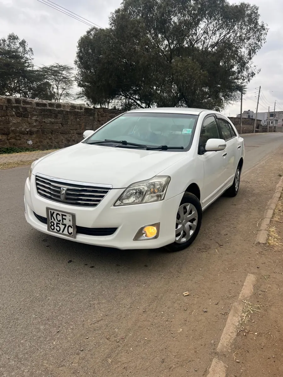 White Toyota Premio: front three-quarter view
