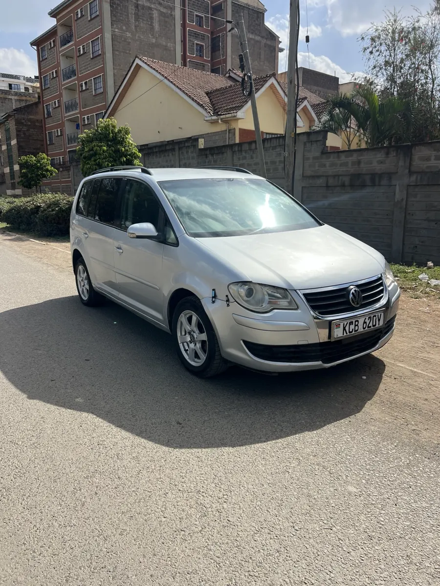 Silver Volkswagen Touran seven-seater: front three-quarter view